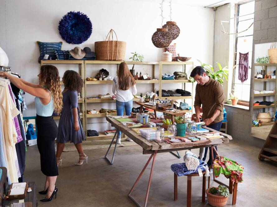 Customers and staff in a busy clothes shop