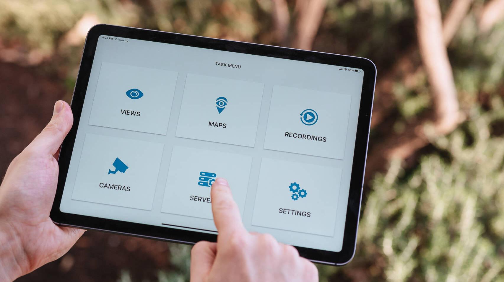 man holding an ipad, CompleteView iOS - Menu