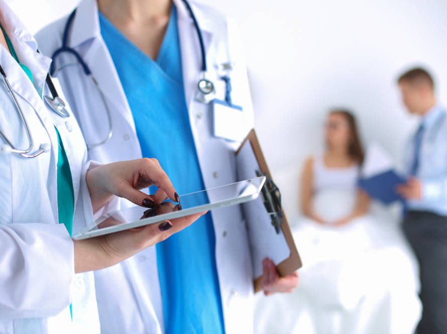 Young woman doctor holding a tablet pc