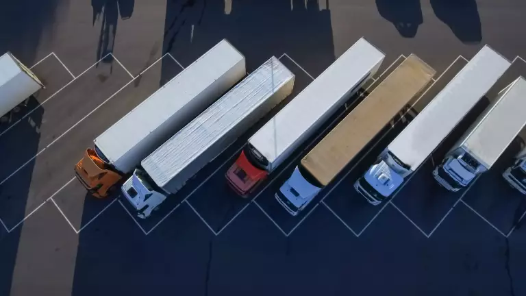 Aerial Top View Of White Semi Truck With Cargo Trailer