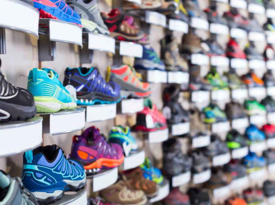 Image of shelves of the store with sport shoes.